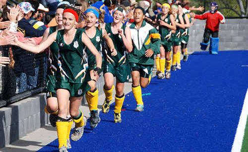 The new state champions Ipswich do a lap of honour around the Gympie hockey field. The new state champions Ipswich do a lap of honour around the Gympie hockey field.